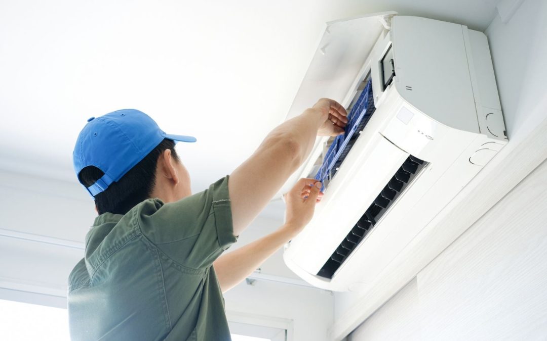 Air conditioning technician maintaining an indoor mini split system in Scottsdale, AZ
